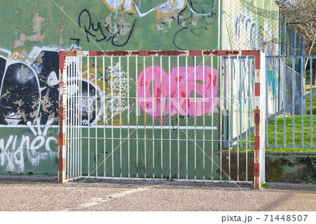 Street football goal on the old football pitch with painted walls 71448507