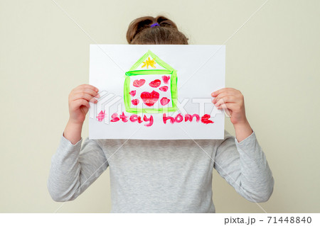 Kid holds drawn rainbow. Kid holds drawn rainbow. 71448840