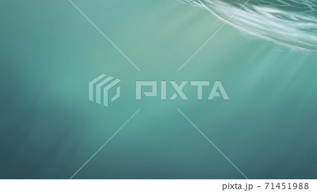 Depth ocean background realistic illustration. Atmospheric landscape of the sea horizon on a hollow day. The sun's rays make their way through the water. Depth ocean background realistic illustration. Atmospheric landscape of the sea horizon on a hollow day. The sun's rays make their way through the water. 71451988