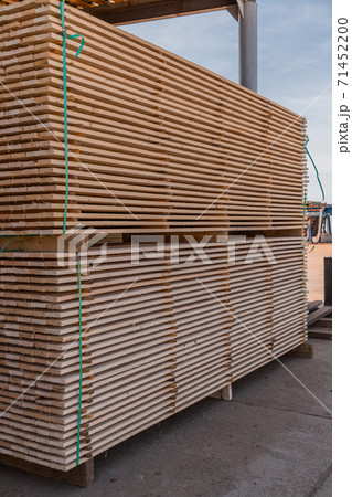 Stack of chopped planks ready to be shipped. Lumber industry. Woodworking factory. 71452200