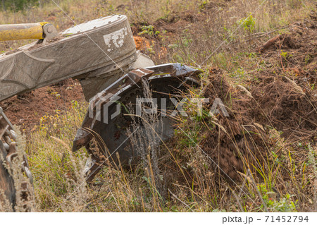 Forest restoration harvester makes furrows for planting spruce pine seedlings. Reforestation on the planet. Working process of planting a tree. 71452794
