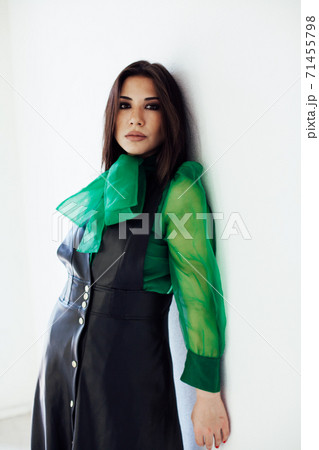 Beautiful fashionable brunette woman in black green portrait dress 71455798