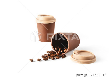 Two beautiful takeaway cups made of chocolate with coffee beans spilled on isolated white background. Abstract design template on white backdrop. Food and drink concept. Coffee background. 71455812