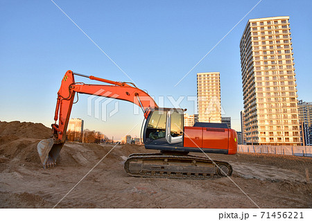 Excavator during excavation at construction site. Excavator during excavation at construction site. 71456221