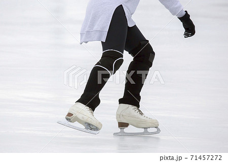 girl ice skating on an ice rink. Hobbies and sports. Vacations and winter activities. girl ice skating on an ice rink. Hobbies and sports. Vacations and winter activities. 71457272