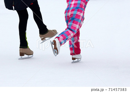 children skate on the ice rink children skate on the ice rink 71457383