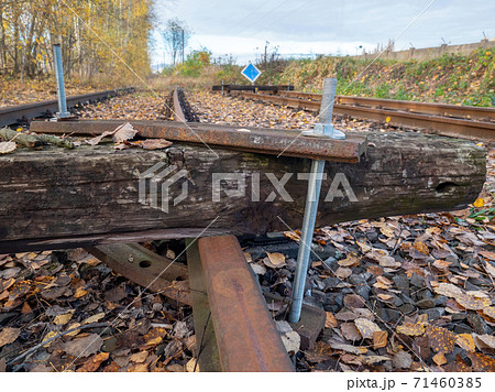 The sleeper screwed acrossing railway. Railroad with vanishing point. 71460385