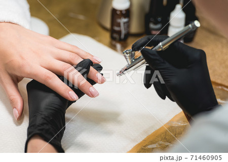 Closeup shot of a woman in a nail salon receiving 71460905