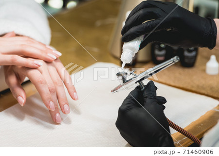 Closeup shot of a woman in a nail salon receiving 71460906