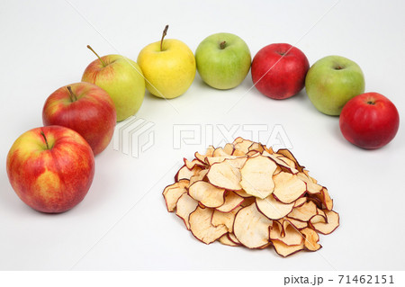 Dried Apple surrounded by fresh apples on white background 71462151