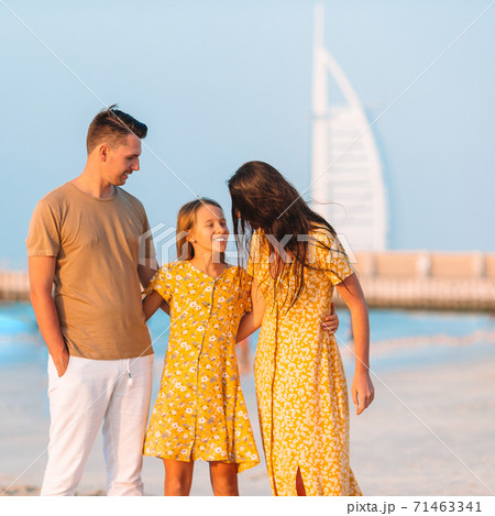Happy family on the beach during summer vacation Happy family on the beach during summer vacation 71463341