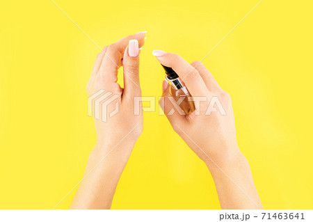 Concept of COVID-19 outbreak protection with antiseptic. Woman using hand sanitizer or antiseptic gel as prevention measure for coronavirus 71463641