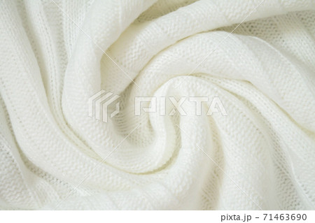 Background of woolen knitted white warm sweater from above 71463690