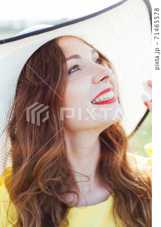portrait of a beautiful fashionable woman in a hat with fields portrait of a beautiful fashionable woman in a hat with fields 71465578