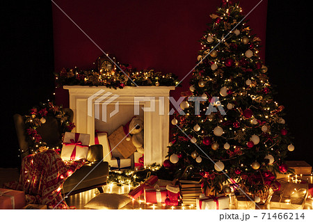 Christmas tree shines lights garlands New Year's Night Red Wall 71466214