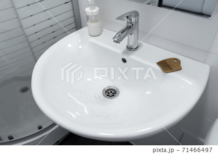Hair loss. Hair in the sink after combing the head 71466497