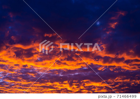 The colors of a burning sunset in the sky 71466499