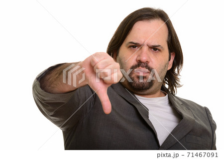 Serious fat Caucasian businessman giving thumb down Serious fat Caucasian businessman giving thumb down 71467091