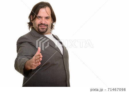 Happy fat Caucasian businessman smiling and giving handshake Happy fat Caucasian businessman smiling and giving handshake 71467098