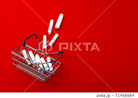Shopping cart with medical tampons close up 71468664