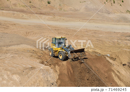 Front end loader has been recovering the landscape around the open pit.  71469245