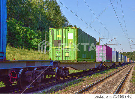 Cargo containers transportation on freight train by railway 71469346