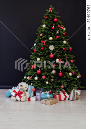 Christmas tree pine with gifts new year decor interior of the holiday postcard Christmas tree pine with gifts new year decor interior of the holiday postcard 71469763