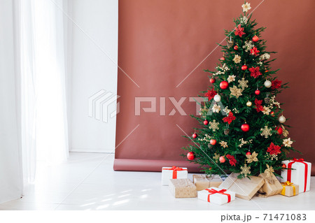 Christmas tree pine with gifts for the new year postcard banner brown background 71471083