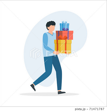 Man carrying many Christmas gifts in his hands. 71471787