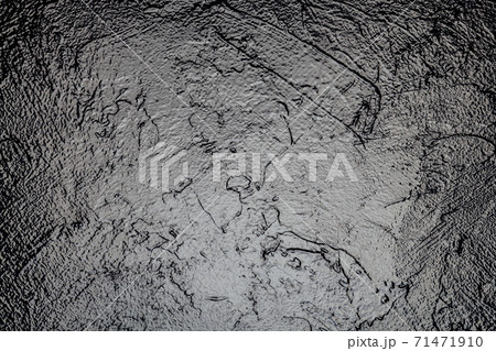 Old black paint vintage wall structure the texture of stone as a background Old black paint vintage wall structure the texture of stone as a background 71471910