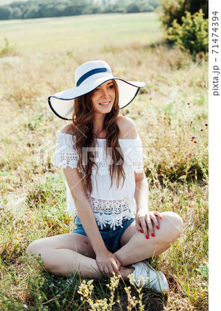 portrait of a beautiful woman in a hat with fields in nature in a field portrait of a beautiful woman in a hat with fields in nature in a field 71474394