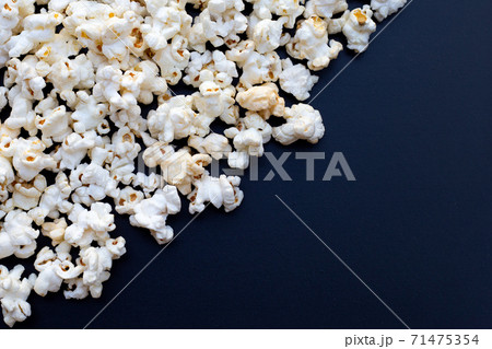 Popcorn on dark background. Copy space 71475354