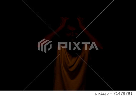 Man gestures with his hands emotions displeasure white t-shirt blue background 71479791