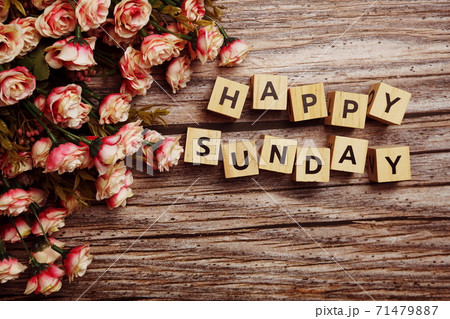 Happy Sunday alphabet letters with flower decoration on wooden background Happy Sunday alphabet letters with flower decoration on wooden background 71479887