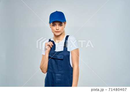 Woman in working uniform blue cap service lifestyle service Woman in working uniform blue cap service lifestyle service 71480407