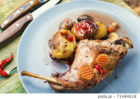 Roasted rabbit on a plate 71484618