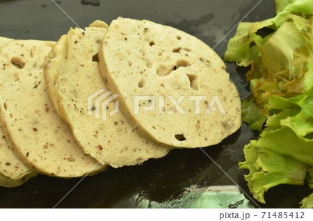 slice steamed mashed pork and mushroom sausage Vietnamese style with lettuce on plate slice steamed mashed pork and mushroom sausage Vietnamese style with lettuce on plate 71485412