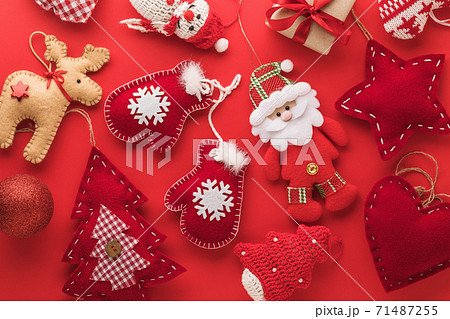 Background from textile christmas toys on a red background Background from textile christmas toys on a red background 71487255