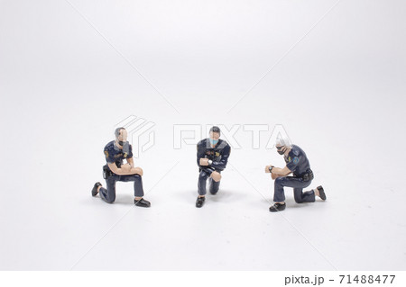 a figurine standing on one knee, black lives matter concept a figurine standing on one knee, black lives matter concept 71488477