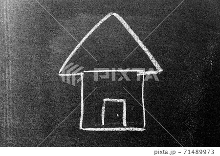 White color chalk hand drawing in home shape on blackboard background White color chalk hand drawing in home shape on blackboard background 71489973