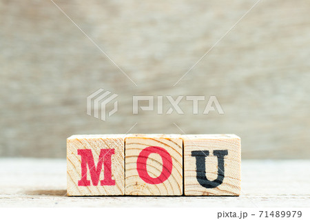 Alphabet letter block in word MOU (Abbreviation of memorandum of understanding) on wood background Alphabet letter block in word MOU (Abbreviation of memorandum of understanding) on wood background 71489979