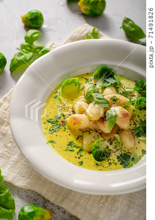 Gnocchi in curry sauce Gnocchi in curry sauce 71491826