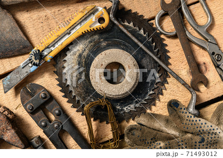 Old vintage household hand tools still life on a wooden background in a DIY and repair concept 71493012