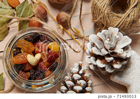 christmas decoration in rustic style and holiday background, still life on wooden backdrop, bread, nuts and other 71493013