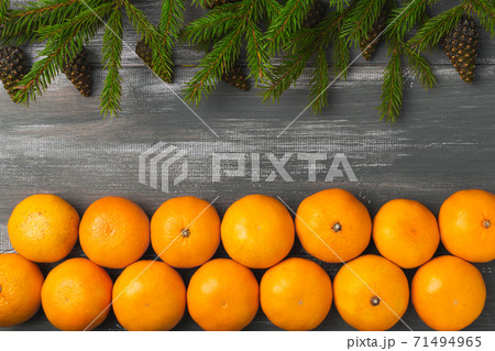 Mandarins for with fir branches Merry Christmas and Happy New Year horizontal layout 71494965