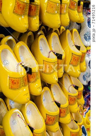 Kinderdijk, The Netherlands, August 2019. Souvenir Dutch clogs, produced in different shapes and colors, make a good show in the display. 71495216