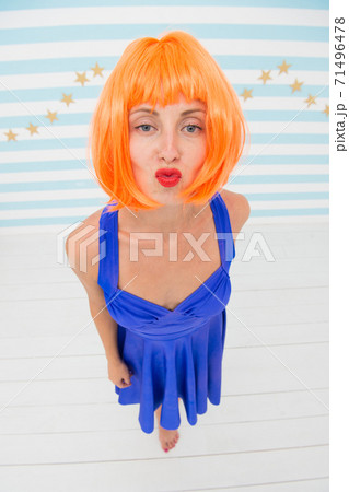 party girl with crazy look. crazy girl send kiss to a camera. party girl with crazy look. crazy girl send kiss to a camera. 71496478
