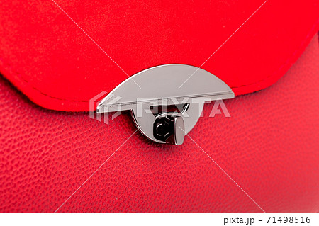 handbag with leather and suede red color, female accessory close up details lock closing bag, nobody. handbag with leather and suede red color, female accessory close up details lock closing bag, nobody. 71498516