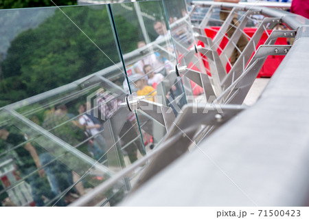 steel fastenings of protective glass on the pedestrian bridge close up. steel fastenings of protective glass on the pedestrian bridge close up. 71500423