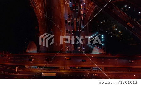 Aerial top-down view of rush hour big traffic jam on the highway interchange in the evening 71501013